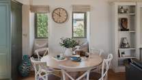 The cute circular dining table is perfect for meal times together