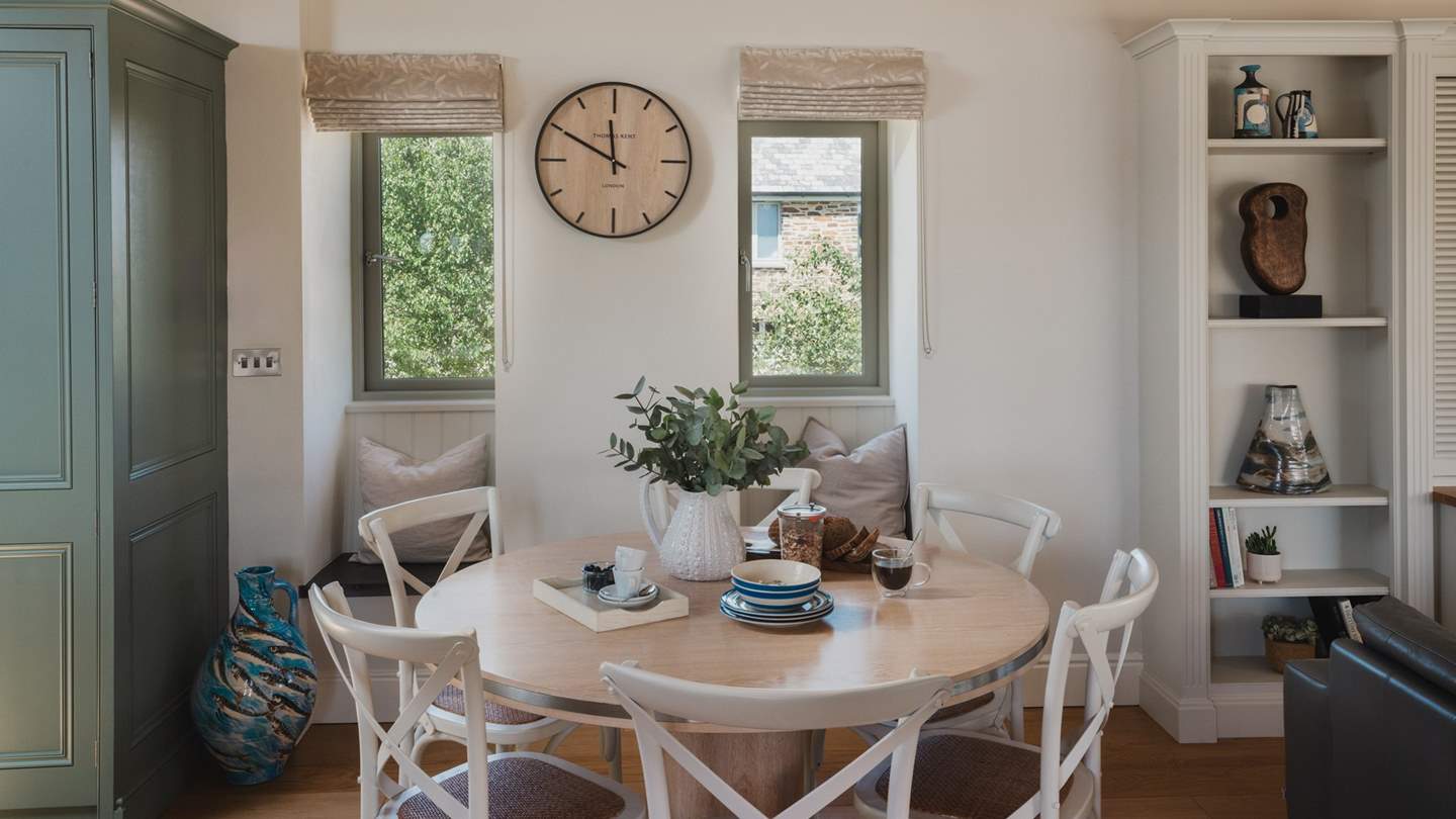 The cute circular dining table is perfect for meal times together