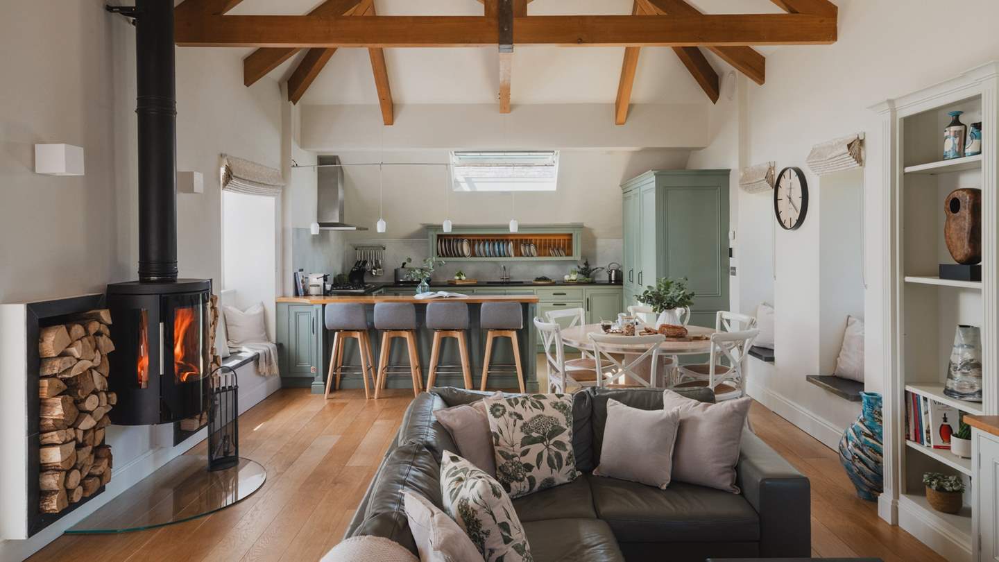 We adore the open plan living, with large vaulted ceiling and exposed beams