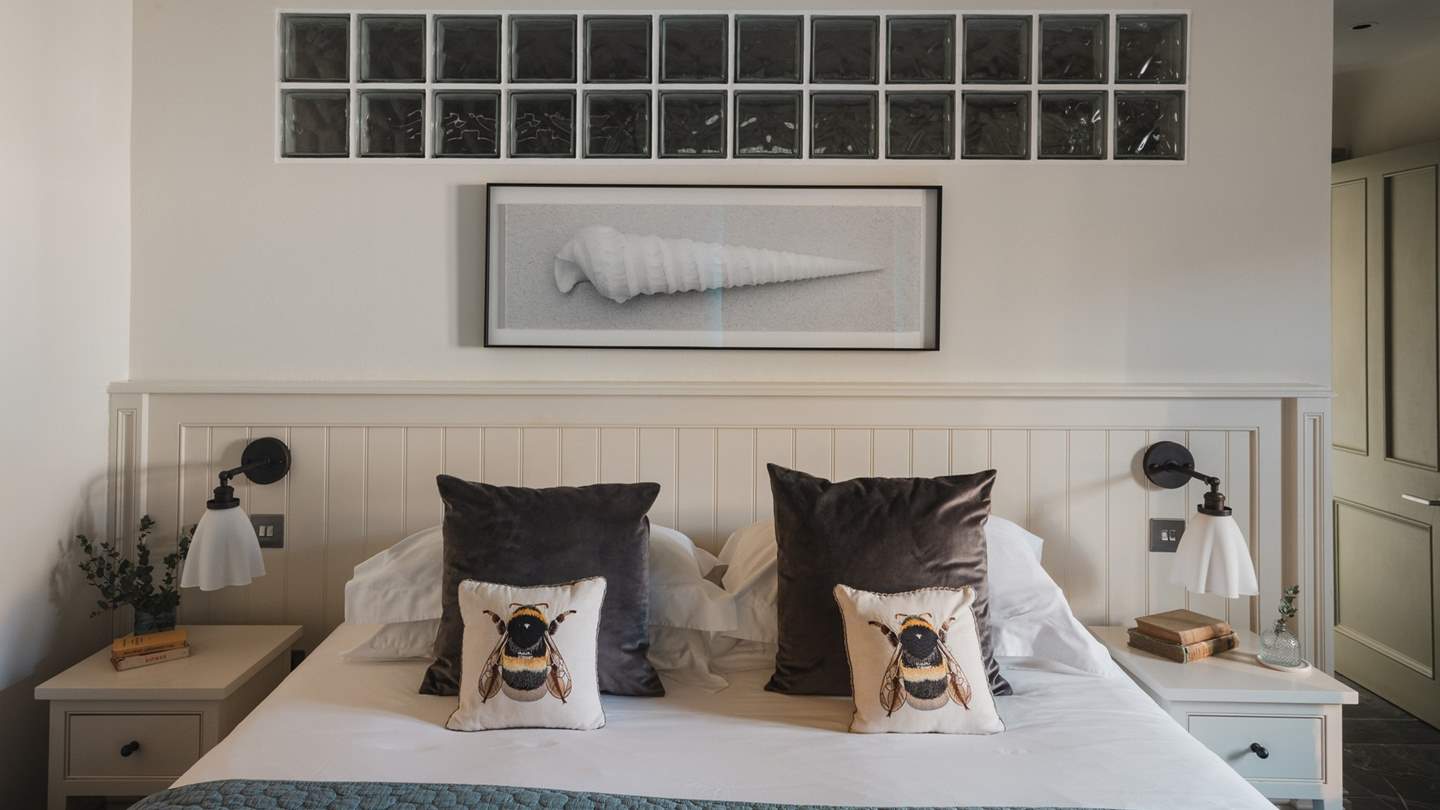 Dressed in soft blues and gentle neutrals, this space invites quiet and peaceful living 