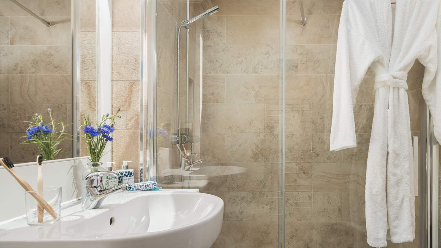 You'll find a spacious walk-in shower for refreshing wake-me ups