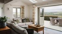 Push open the bi-fold doors on balmy days to enjoy endless countryside-vistas at our heavenly retreat 
