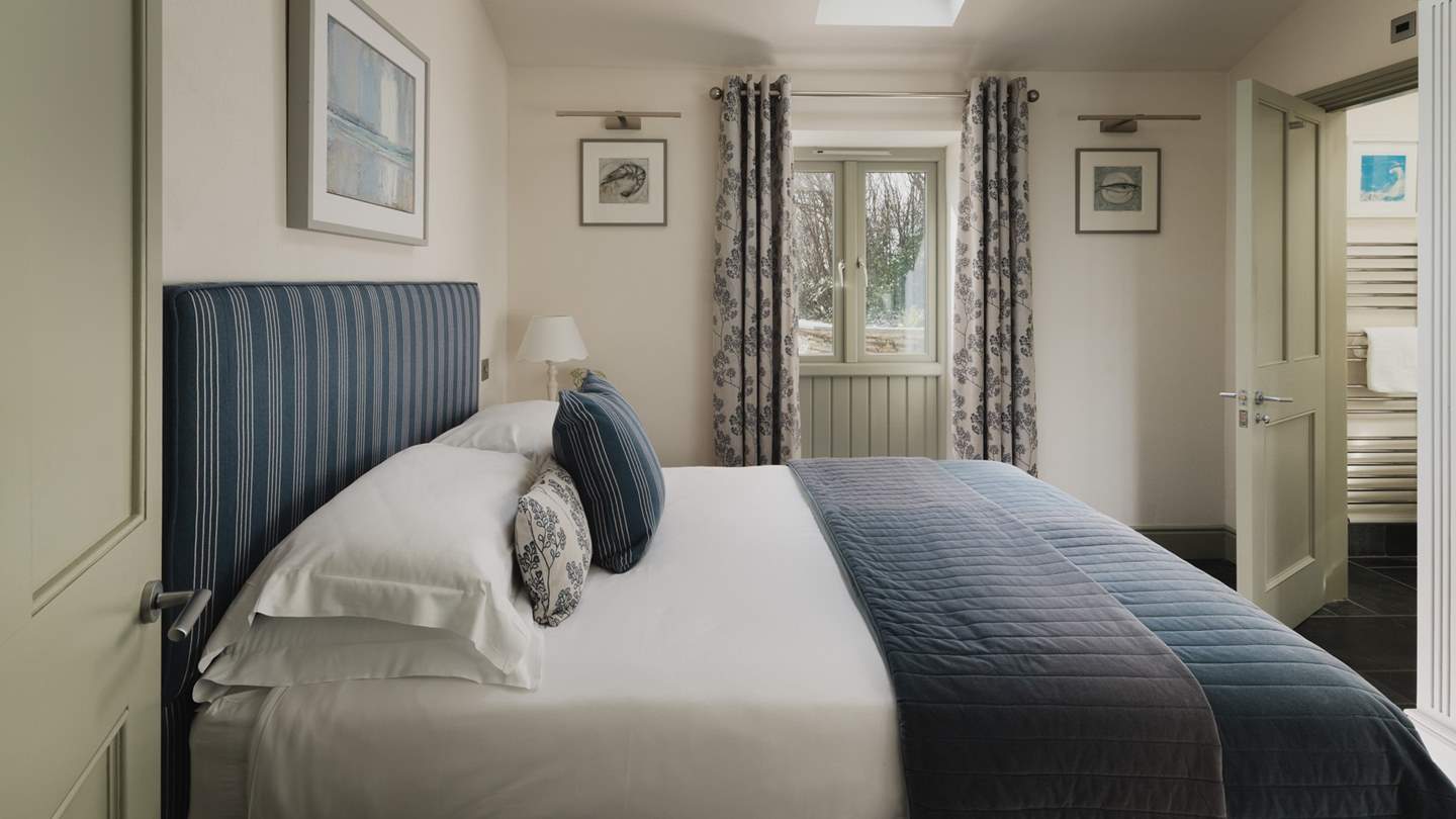 Decorated in soothing hues this bedroom promises moments of comfort and calm