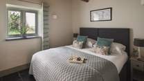 Calling for slow mornings and restful nights, the second bedroom is simply a delight
