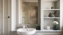 Toiletries are provided in both, alongside thick, fluffy white towels