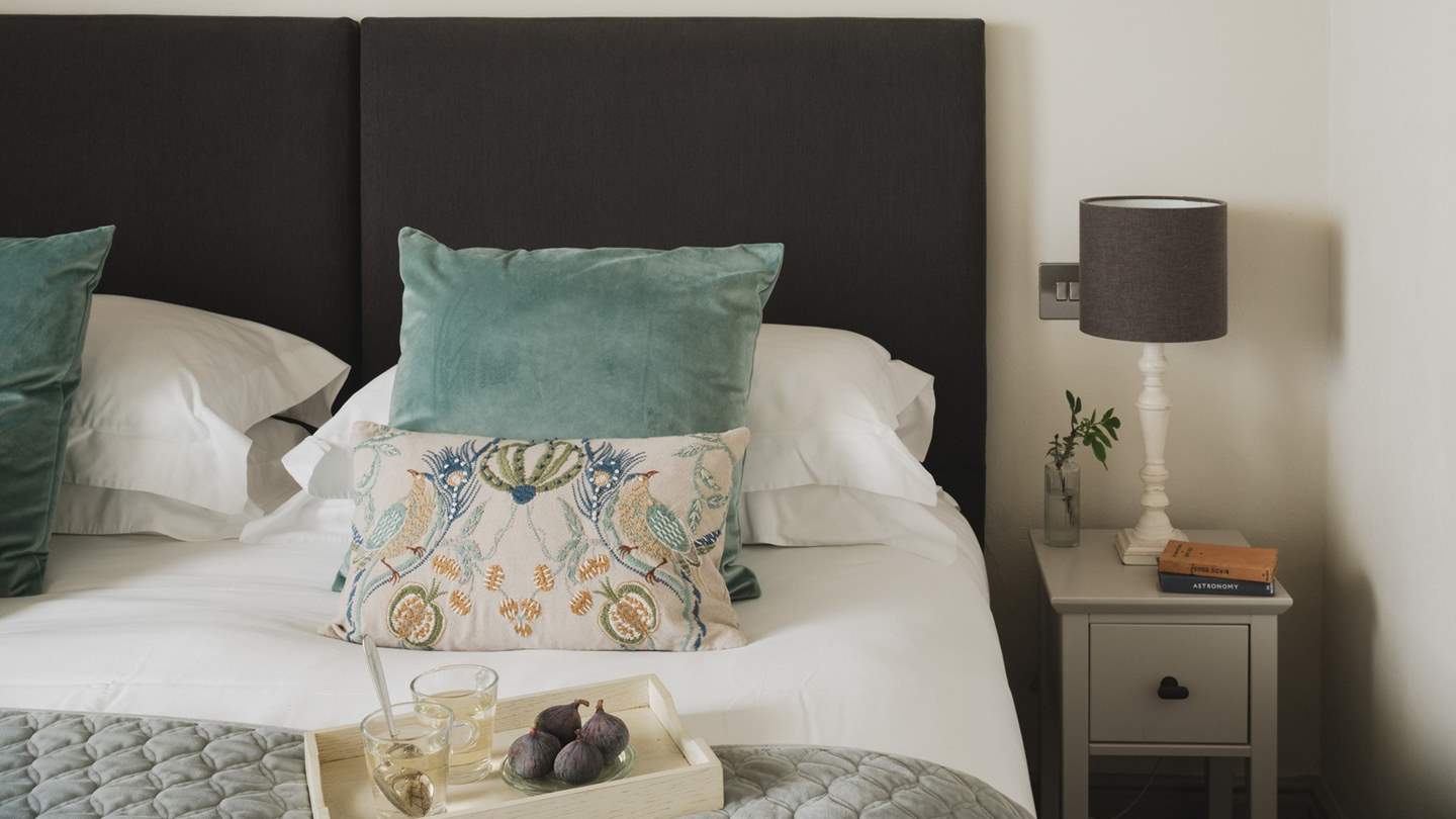 Slip softly into the king-sized bed, swathed in luxurious linens, soft bedding