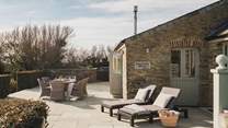 The fully enclosed patio and garden to the front of the cottage affording great views of the rolling coutryside opposite